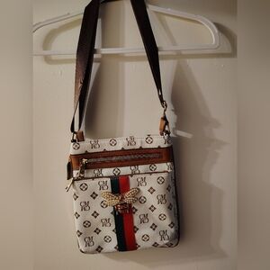 Chic Designer Crossbody Bag with Gold Accents
